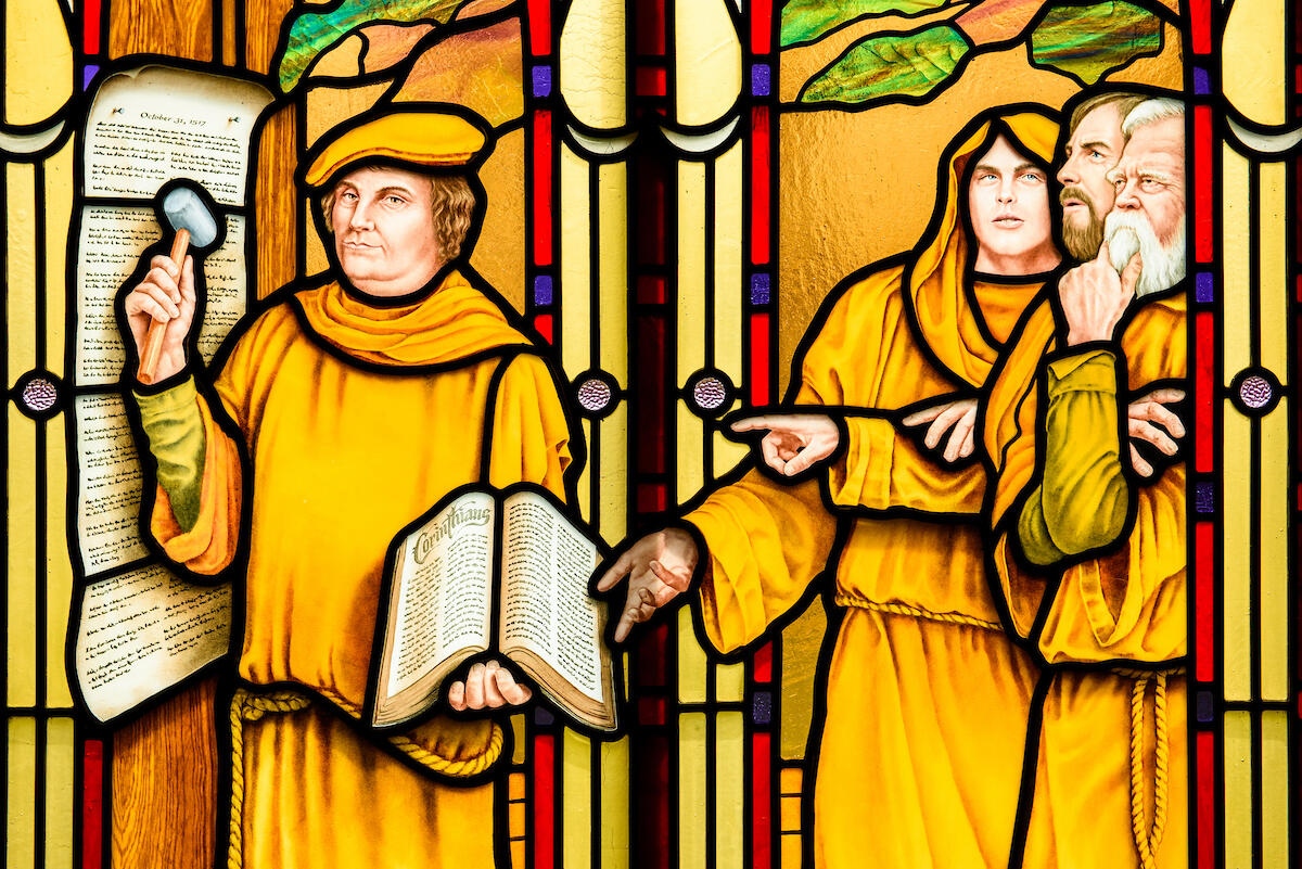 Stained glass at St. Paul Evangelical Lutheran Church in Columbus, Ind., depicts Martin Luther nailing the 95 Theses to the Castle Church in Wittenberg, Germany, photographed Sunday, April 10, 2016. LCMS Communications/Erik M. Lunsford